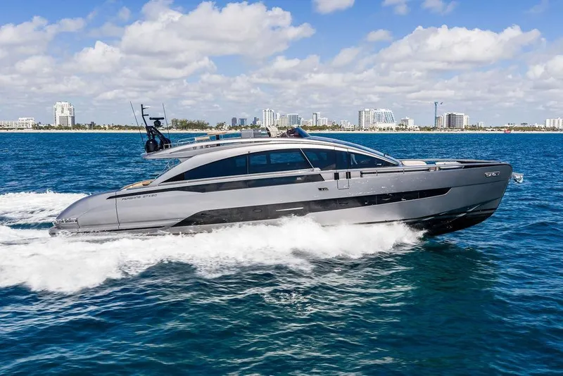Slide: The Image of 2025 Pershing GTX 80 yacht cruising on blue ocean near city skyline. - 19
