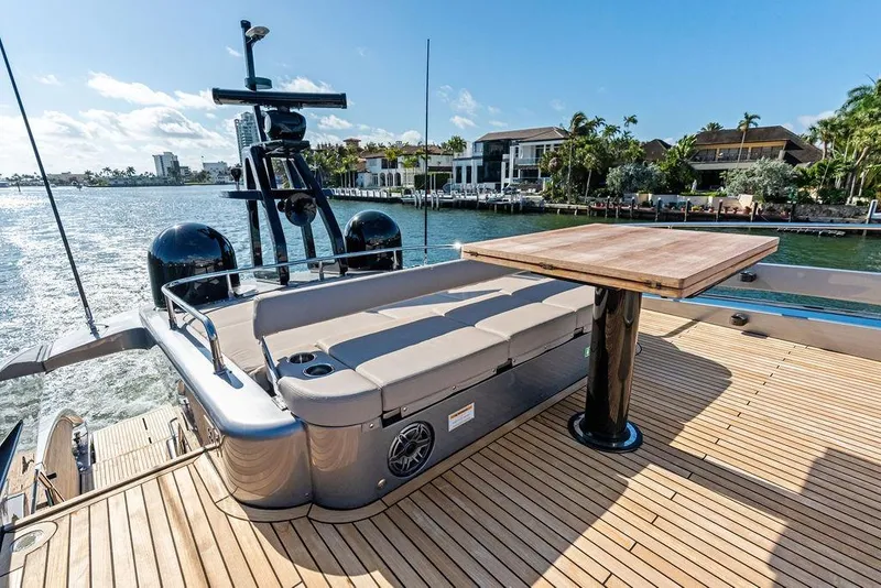 Slide: The Image of Luxury Pershing GTX 80 yacht deck with seating and table, 2025 model. - 33