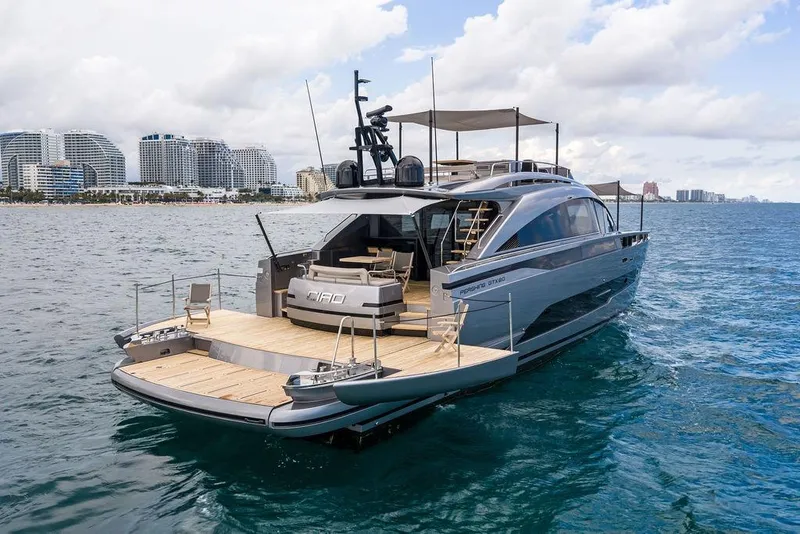Slide: The Image of Luxury Pershing GTX 80 yacht cruising near a coastal city skyline, 2025 model. - 8