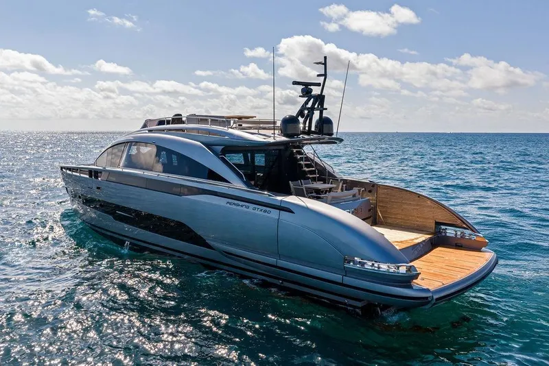 Slide: The Image of Luxurious 2025 Pershing GTX 80 yacht cruising on open sea under clear skies. - 13