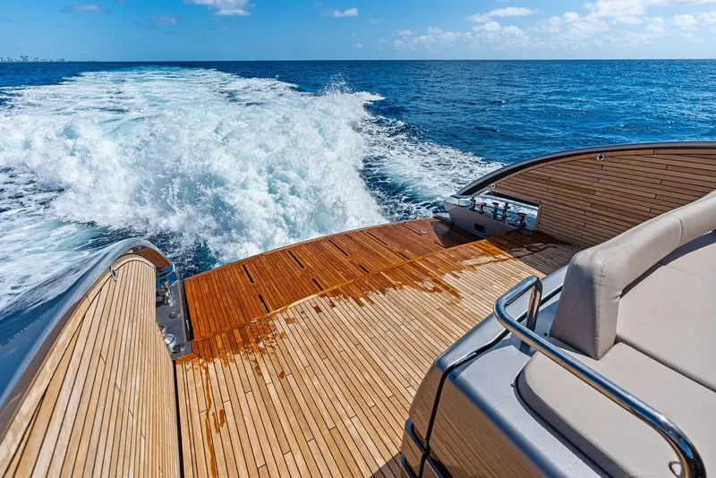 Slide: The Image of Luxury yacht Pershing GTX 80 cruising on open sea, showcasing elegant wooden deck. - 41