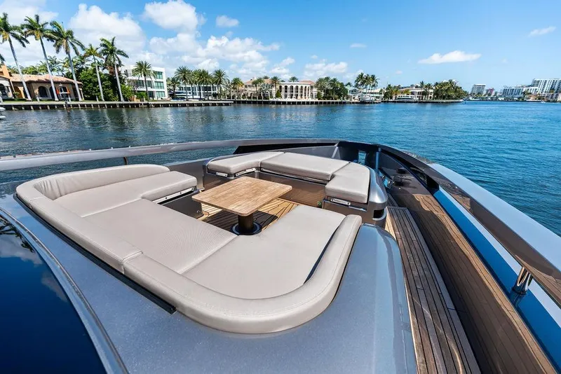 Slide: The Image of Luxurious 2025 Pershing GTX 80 yacht deck with elegant seating and scenic waterfront view. - 46