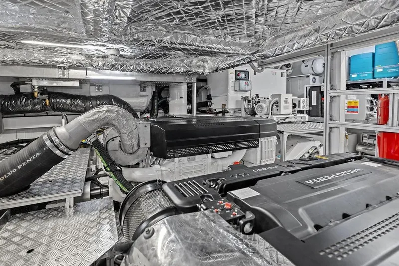 Slide: The Image of Engine room of 2025 Pershing GTX 80 yacht, featuring Volvo Penta engines and advanced equipment. - 99