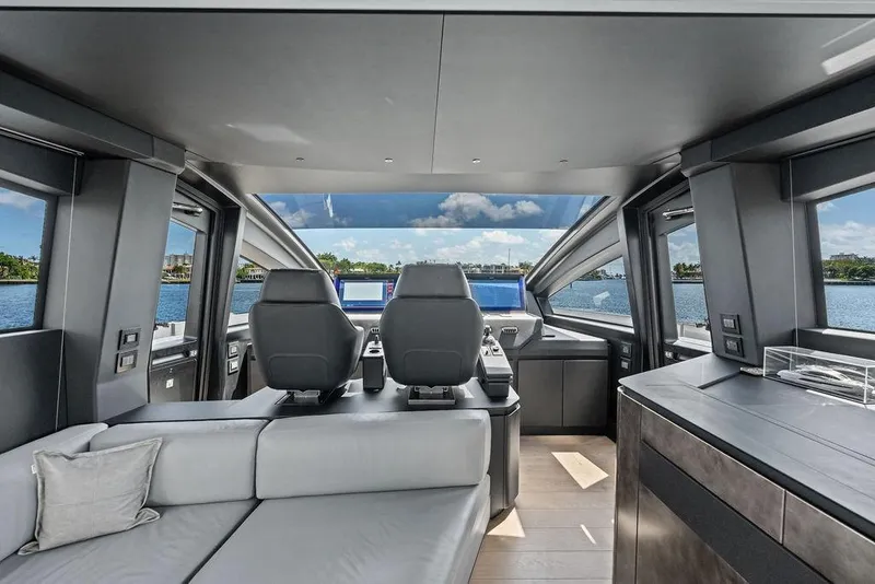 Slide: The Image of Luxurious interior of 2025 Pershing GTX 80 yacht with modern seating and panoramic windows. - 62