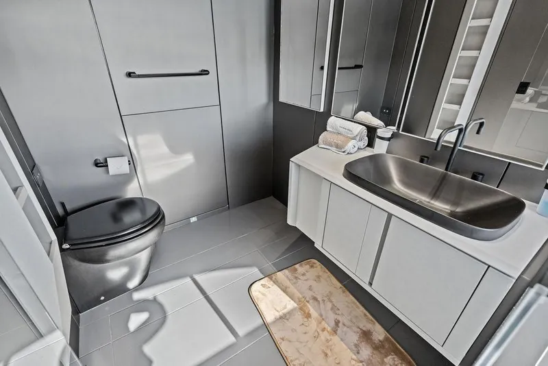 Slide: The Image of Modern bathroom interior on 2025 Pershing GTX 80 yacht, featuring sleek fixtures and minimalist design. - 82