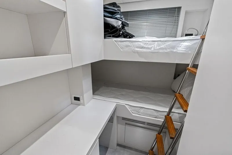Slide: The Image of Compact bunk bed cabin interior on 2025 Pershing GTX 80 yacht. - 90