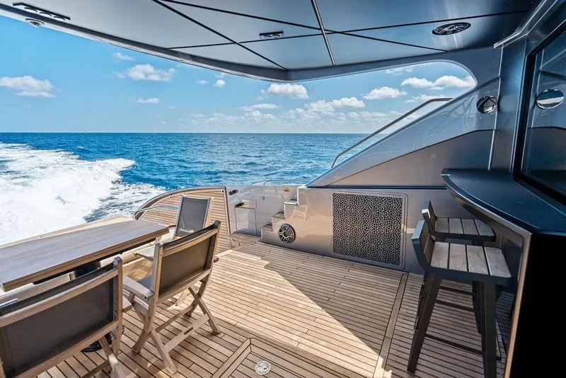 Slide: The Image of Luxurious 2025 Pershing GTX 80 yacht deck with ocean view and elegant seating. - 42