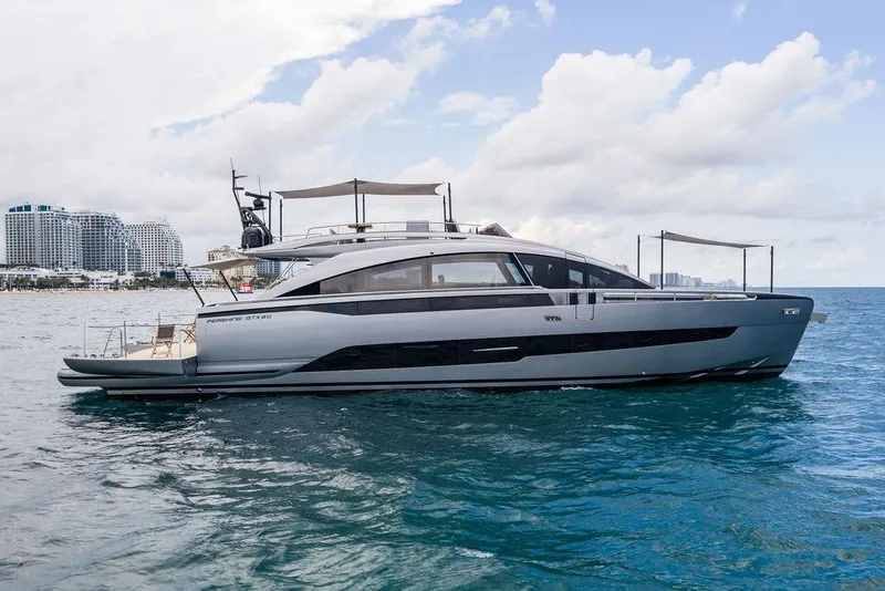 Slide: The Image of 2025 Pershing GTX 80 yacht on ocean, modern design, city skyline background. - 1