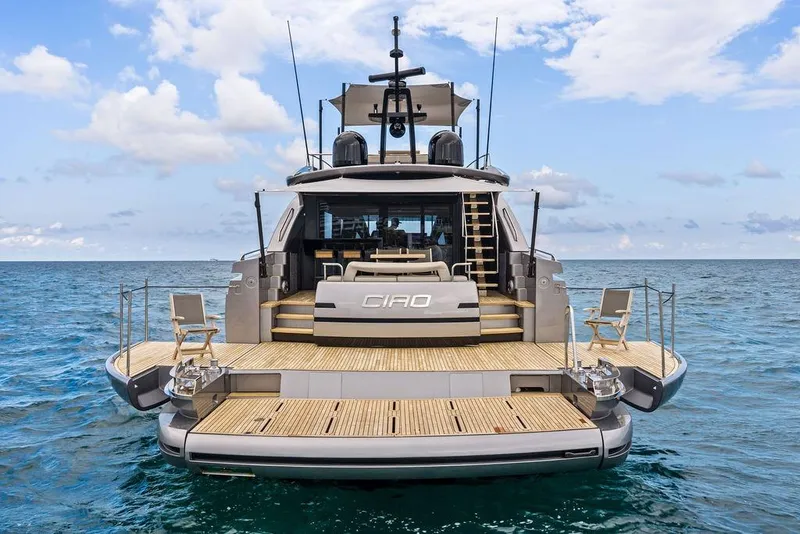 Slide: The Image of Luxury Pershing GTX 80 yacht, 2025 model, on open sea with elegant deck design. - 12