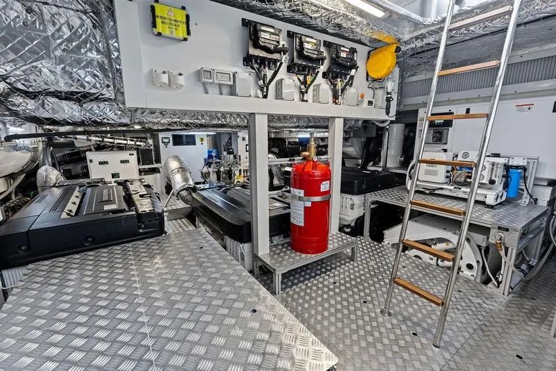 Slide: The Image of Engine room of 2025 Pershing GTX 80 yacht with advanced machinery and safety equipment. - 101