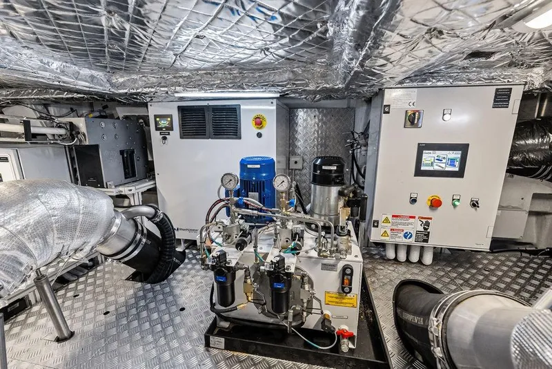 Slide: The Image of Engine room of 2025 Pershing GTX 80 yacht with advanced machinery and control panels. - 104