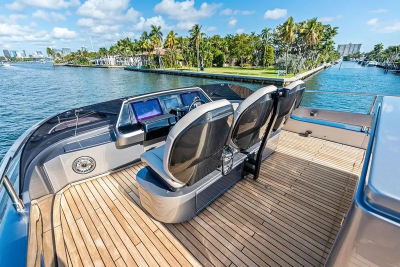 Slide: The Image of Luxurious 2025 Pershing GTX 80 yacht deck with sleek seating and scenic waterfront view. - 30