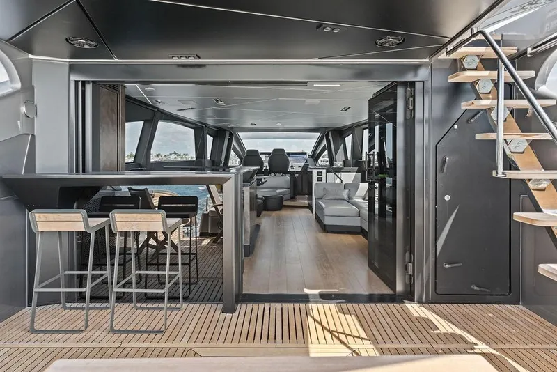 Slide: The Image of Luxurious interior of 2025 Pershing GTX 80 yacht with modern seating and bar area. - 50