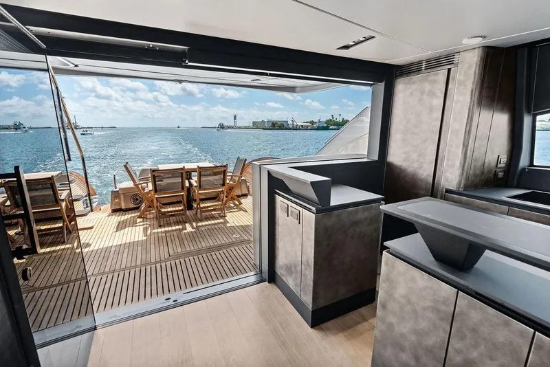 Slide: The Image of Luxurious interior of 2025 Pershing GTX 80 yacht with ocean view and outdoor seating. - 51