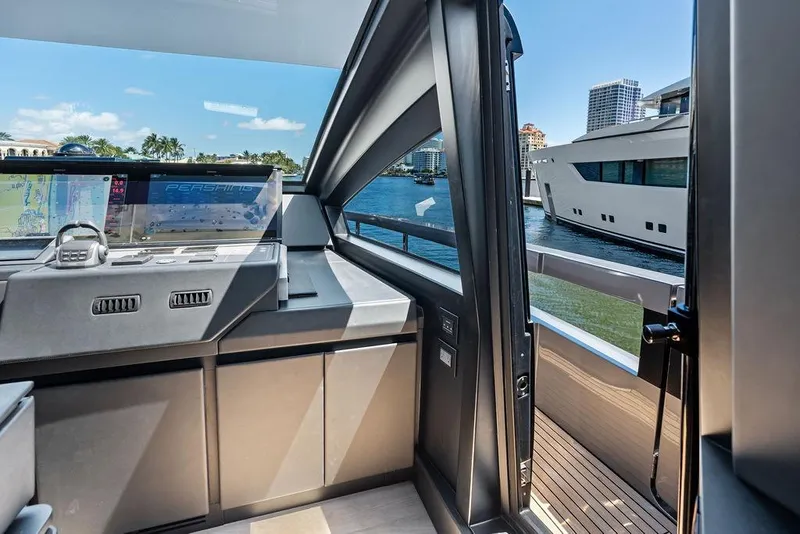 Slide: The Image of Interior view of 2025 Pershing GTX 80 yacht cockpit with navigation screens. - 66