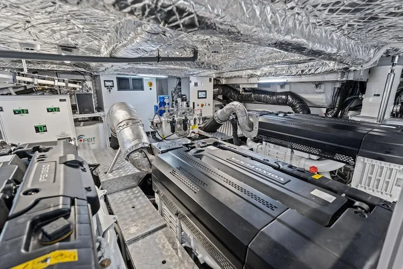 Slide: The Image of Engine room of 2025 Pershing GTX 80 yacht, featuring advanced machinery and equipment. - 102