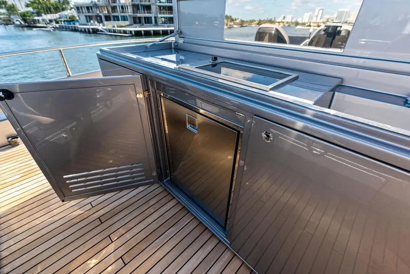 Slide: The Image of Outdoor kitchen on 2025 Pershing GTX 80 yacht with sleek cabinetry and ocean view. - 35
