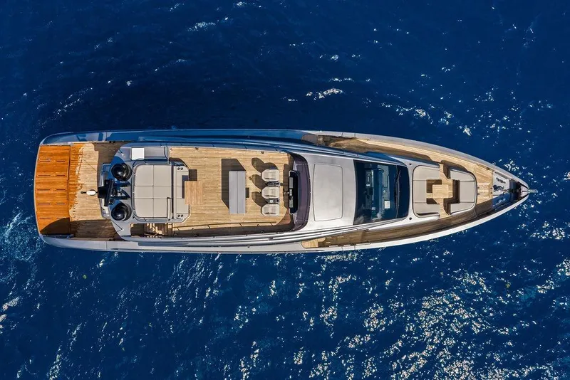 Slide: The Image of Aerial view of 2025 Pershing GTX 80 yacht cruising on deep blue ocean waters. - 27