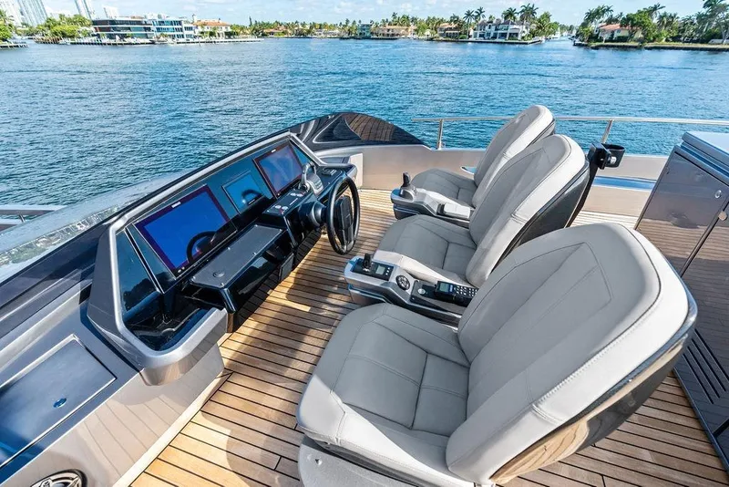 Slide: The Image of Luxurious helm of 2025 Pershing GTX 80 yacht with modern controls and waterfront view. - 38