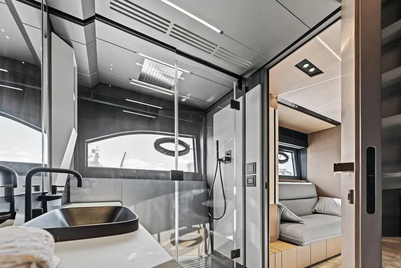 Slide: The Image of Luxurious interior of 2025 Pershing GTX 80 yacht, featuring modern bathroom and cozy seating area. - 75