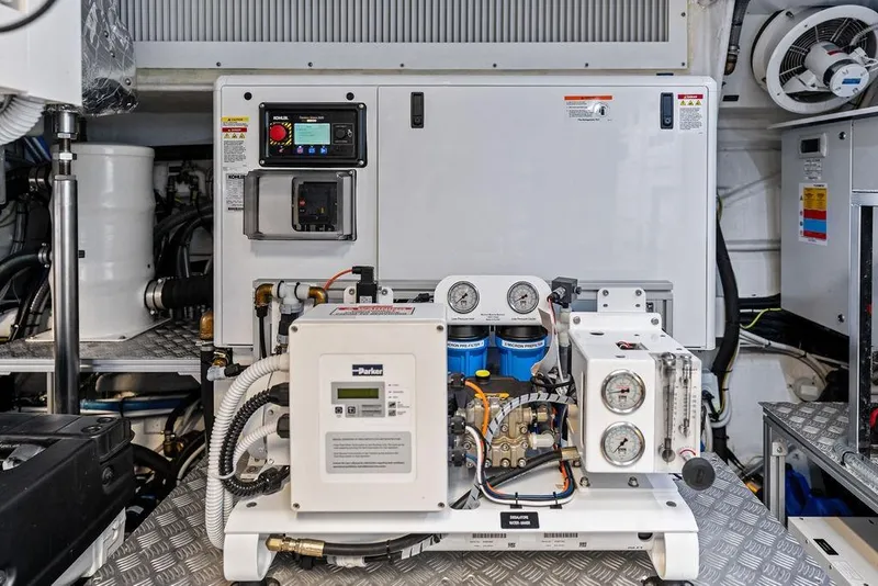 Slide: The Image of Engine room of 2025 Pershing GTX 80 yacht with advanced machinery and control systems. - 95