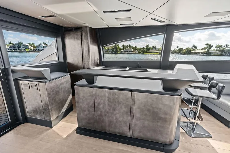 Slide: The Image of Luxurious interior of 2025 Pershing GTX 80 yacht with modern bar and seating area. - 53
