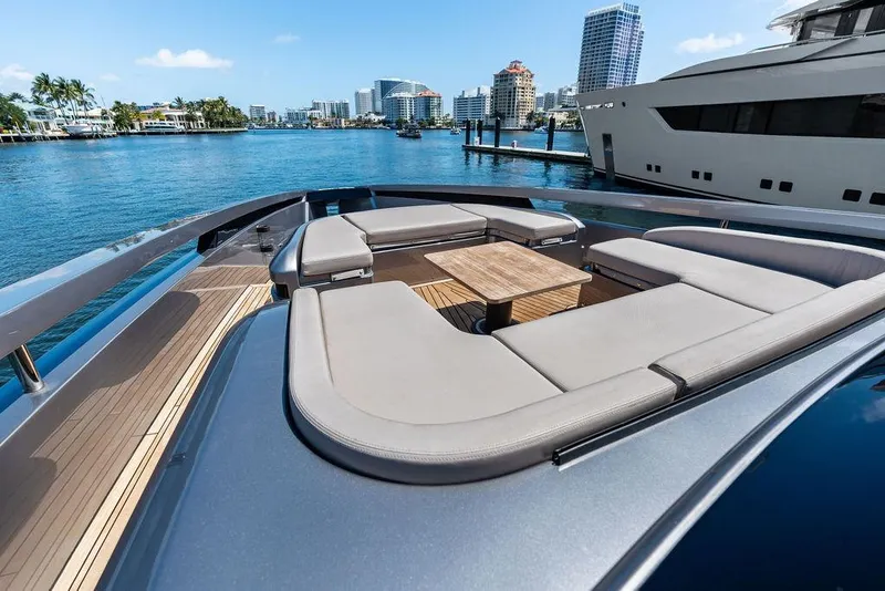 Slide: The Image of Luxurious 2025 Pershing GTX 80 yacht with elegant deck seating and waterfront cityscape. - 48