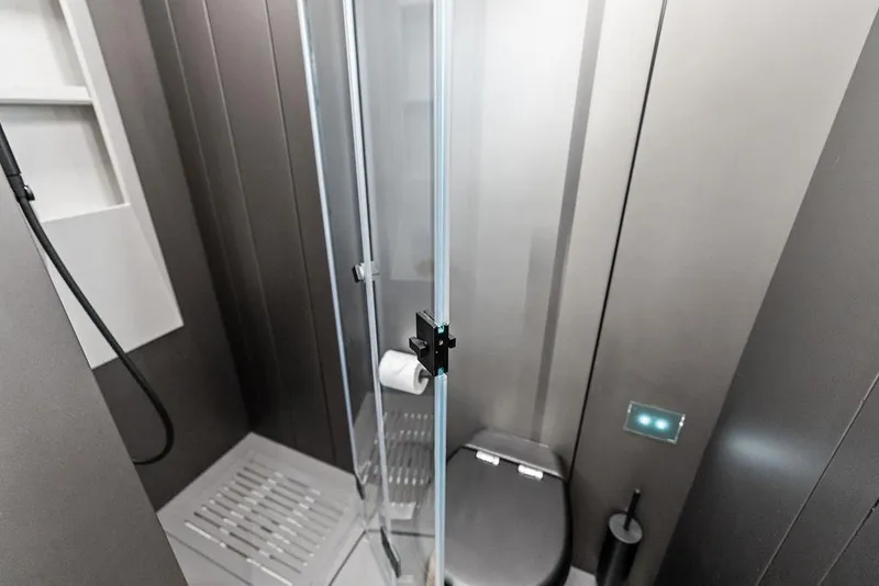 Slide: The Image of Modern bathroom in 2025 Pershing GTX 80 yacht with sleek shower and toilet design. - 83