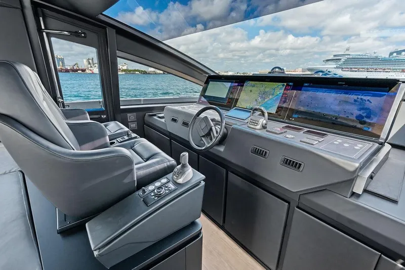 Slide: The Image of Luxurious 2025 Pershing GTX 80 yacht cockpit with advanced navigation systems and leather seating. - 63