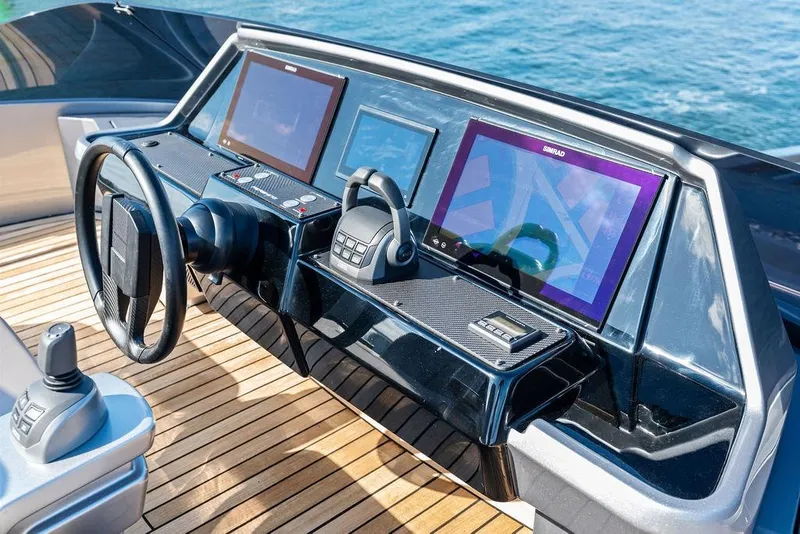 Slide: The Image of Helm of 2025 Pershing GTX 80 yacht with advanced navigation displays and controls. - 40