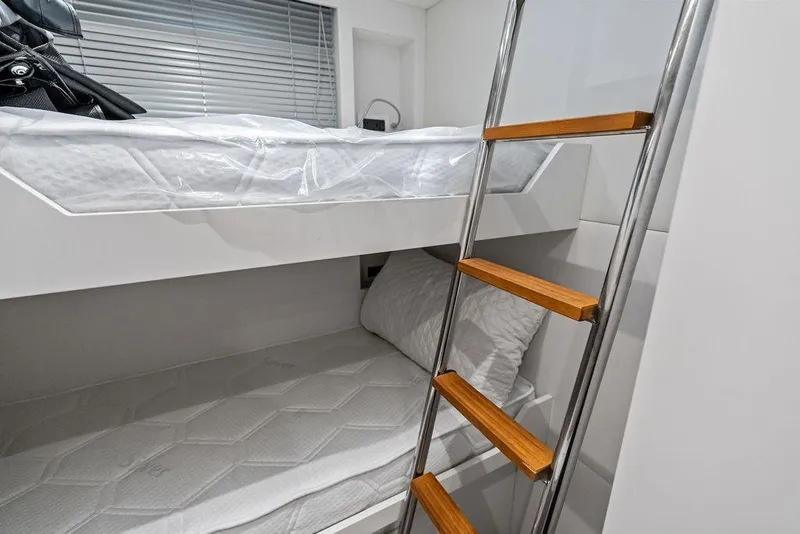 Slide: The Image of Bunk beds with ladder in 2025 Pershing GTX 80 yacht interior. - 92