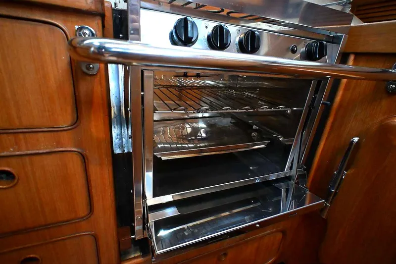 Slide: The Image of Stainless steel oven in 1989 Ta Shing Yachts Taswell 43, featuring wooden cabinetry. - 55