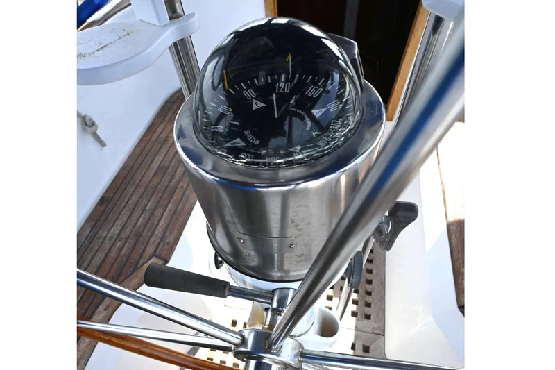 Slide: The Image of Compass on 1989 Ta Shing Yachts Taswell 43, showcasing nautical navigation equipment. - 26