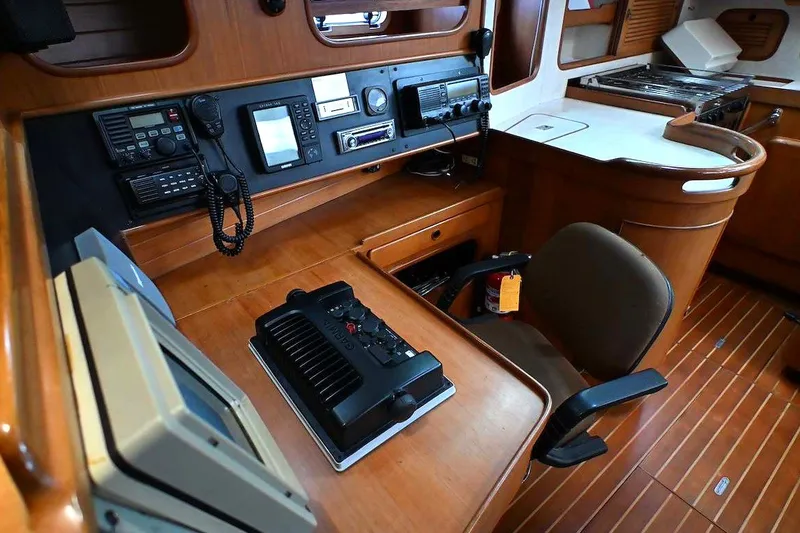 Slide: The Image of 1989 Ta Shing Yachts Taswell 43 interior with navigation equipment and wooden cabinetry. - 52
