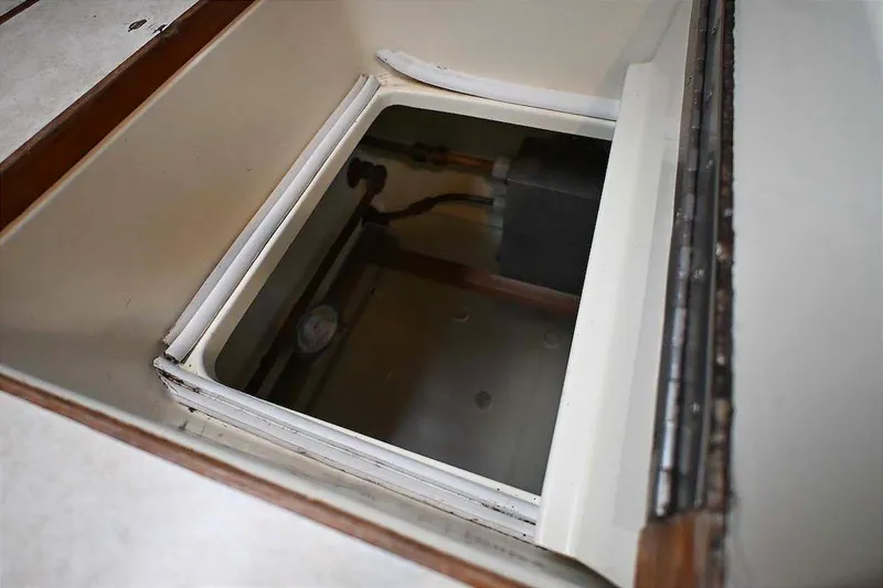 Slide: The Image of Open hatch on 1989 Ta Shing Yachts Taswell 43, revealing interior compartment. - 58