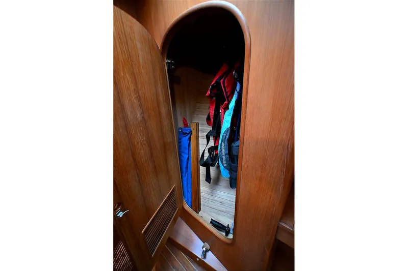 Slide: The Image of Wooden interior of 1989 Ta Shing Yachts Taswell 43, featuring a closet with life jackets. - 67