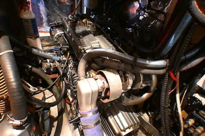 Slide: The Image of Engine room of 1989 Ta Shing Yachts Taswell 43, showcasing complex machinery and components. - 81