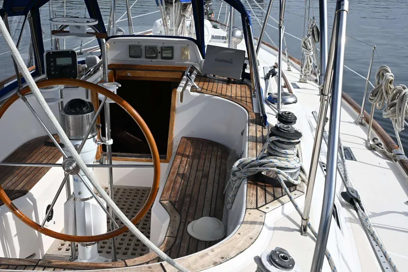 Slide: The Image of Cockpit of 1989 Ta Shing Yachts Taswell 43 sailboat with wooden wheel and navigation instruments. - 25