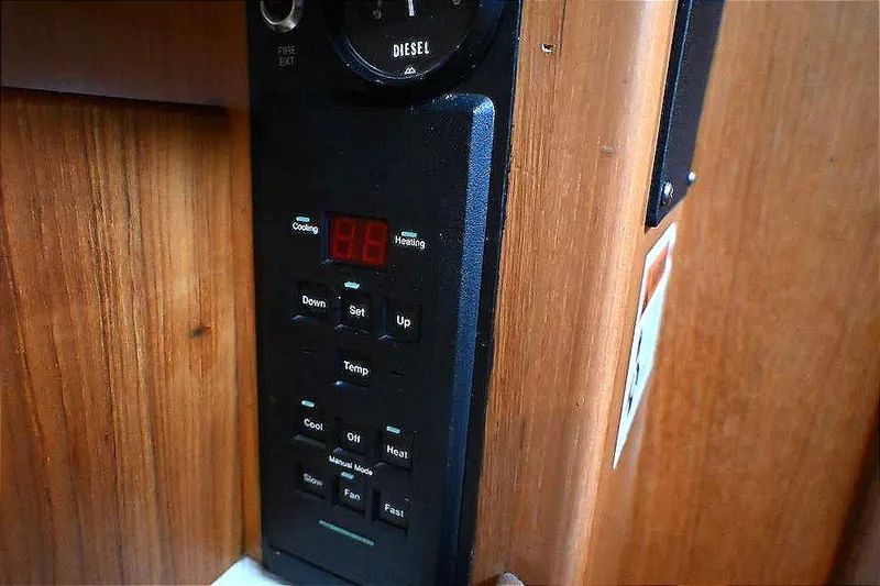 Slide: The Image of Control panel on 1989 Ta Shing Yachts Taswell 43, featuring temperature and fan settings. - 77