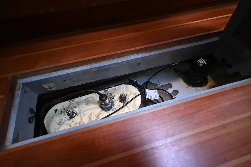 Slide: The Image of Bilge compartment of 1989 Ta Shing Yachts Taswell 43, showcasing wiring and components. - 89