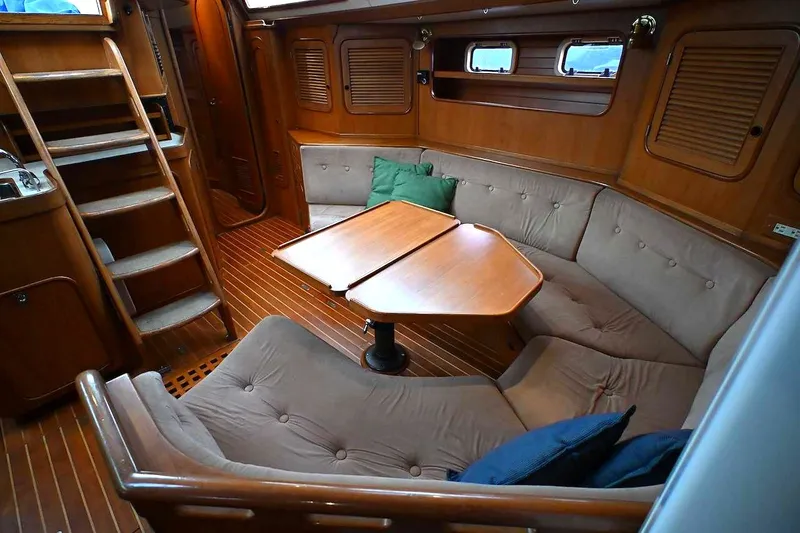 Slide: The Image of Luxurious 1989 Ta Shing Taswell 43 yacht interior with cozy seating and wooden finishes. - 50