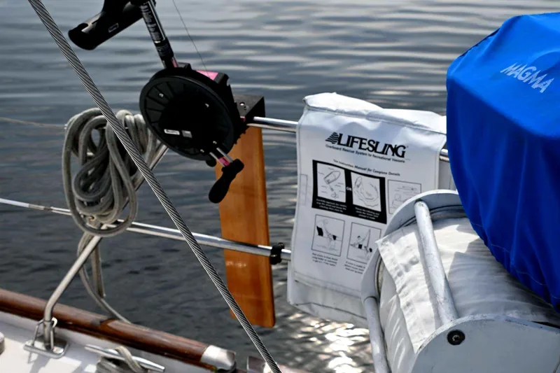 Slide: The Image of Deck of 1989 Taswell 43 yacht with Lifesling and Magma grill cover. - 34