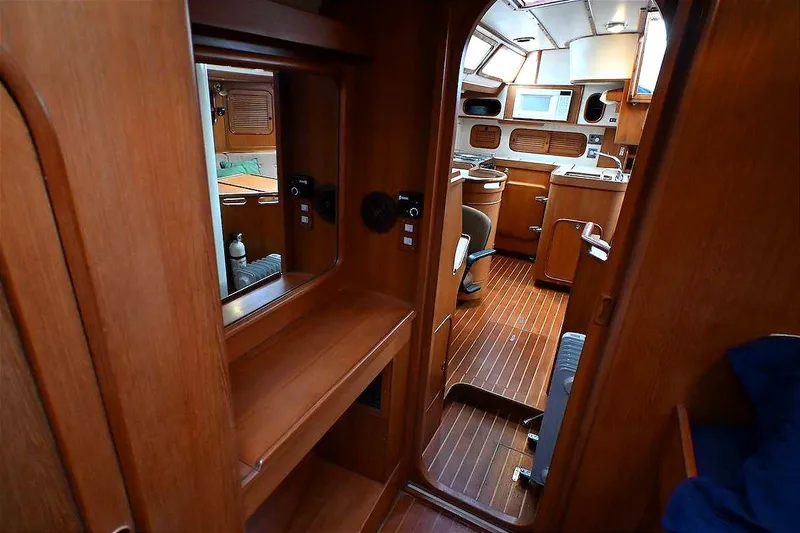 Slide: The Image of Interior of 1989 Ta Shing Yachts Taswell 43, featuring elegant wood finishes and spacious layout. - 61