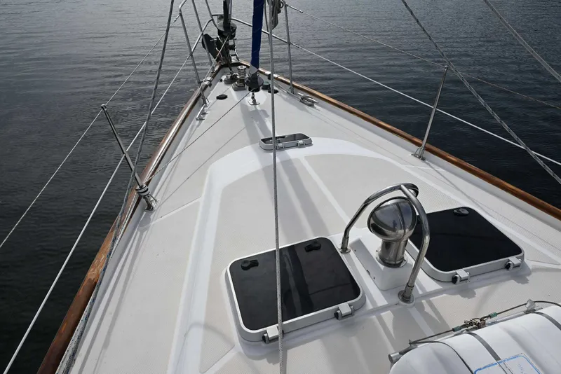 Slide: The Image of Deck view of 1989 Ta Shing Yachts Taswell 43 sailboat, showcasing sleek design and rigging. - 17