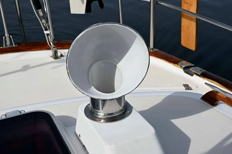 Slide: The Image of Deck vent on 1989 Ta Shing Yachts Taswell 43 sailboat, featuring polished metal and wood accents. - 33