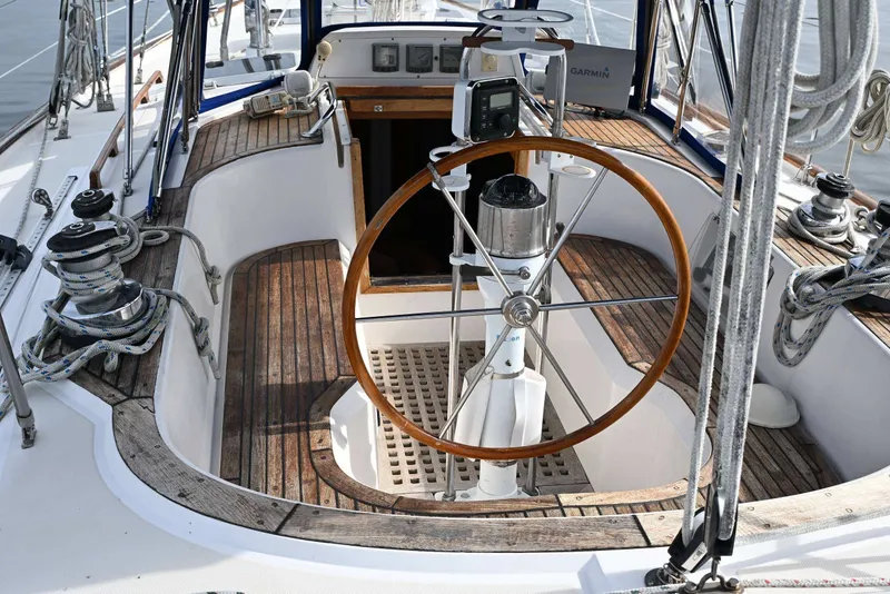Slide: The Image of Cockpit of 1989 Ta Shing Yachts Taswell 43 sailboat with wooden wheel and nautical equipment. - 13
