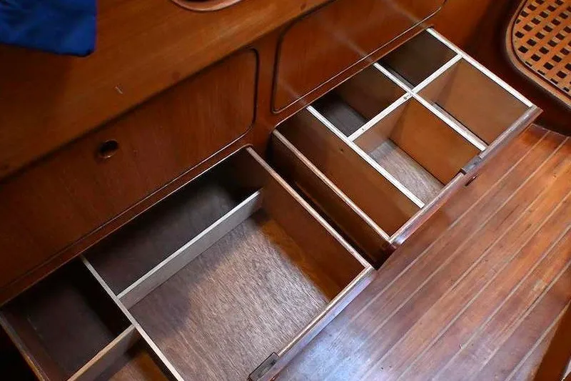 Slide: The Image of Wooden storage drawers on a 1989 Ta Shing Yachts Taswell 43 sailboat. - 64
