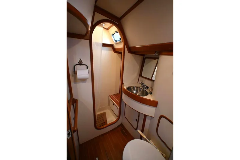 Slide: The Image of 1989 Ta Shing Yachts Taswell 43 bathroom with sink, mirror, and shower. - 43