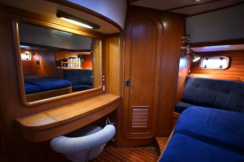 Slide: The Image of Luxurious 1989 Ta Shing Taswell 43 yacht interior with wood finish and cozy seating. - 42