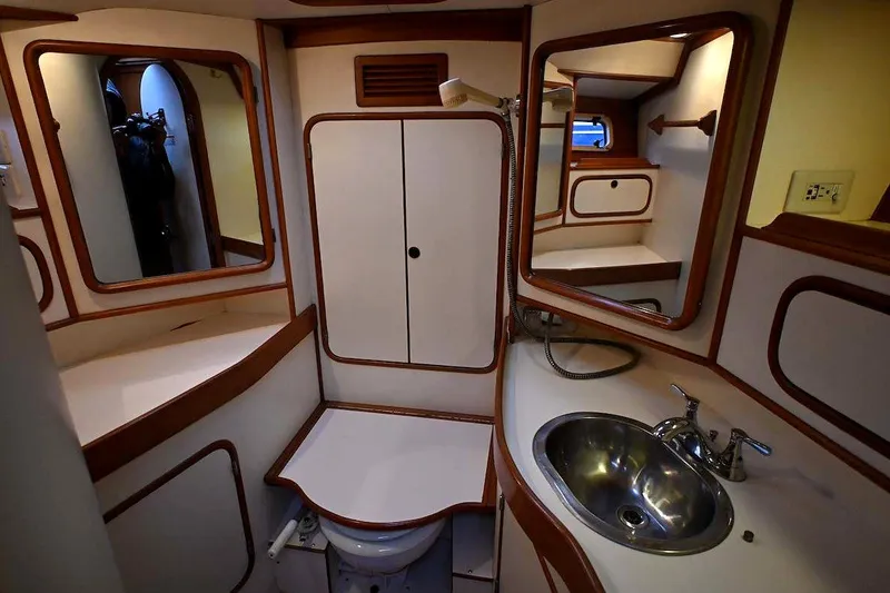 Slide: The Image of Interior of 1989 Ta Shing Yachts Taswell 43 bathroom with sink, mirrors, and storage. - 70